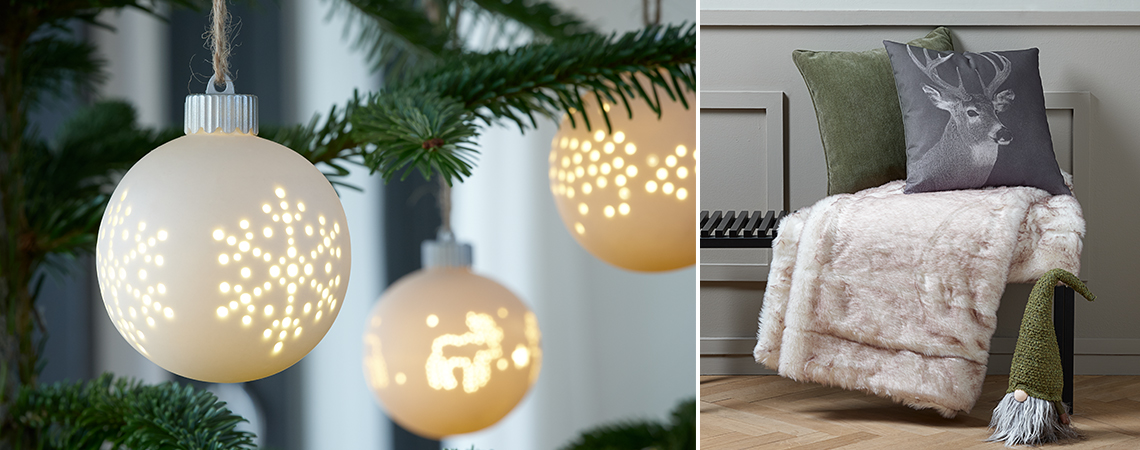 Valkoiset LED-pallot joulukuusessa ja tonttu tyynyjen ja huovan kanssa penkillä