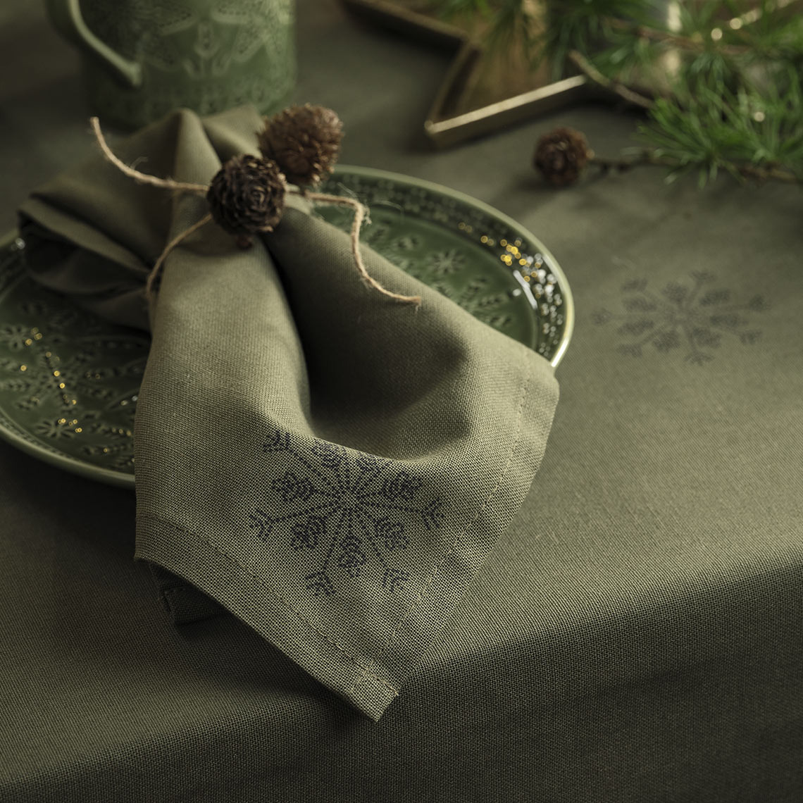 STJERNESTEN tablecloth and cloth napkin Green Christmas tablecloth and Christmas cloth napkin on a green plate
