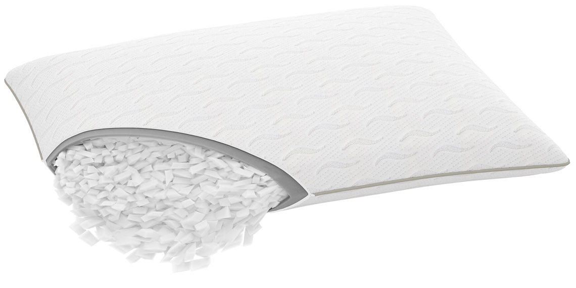 Vetoketjulla varustetty tyyny, joka on avattu niin, että täytettä tulee ulos