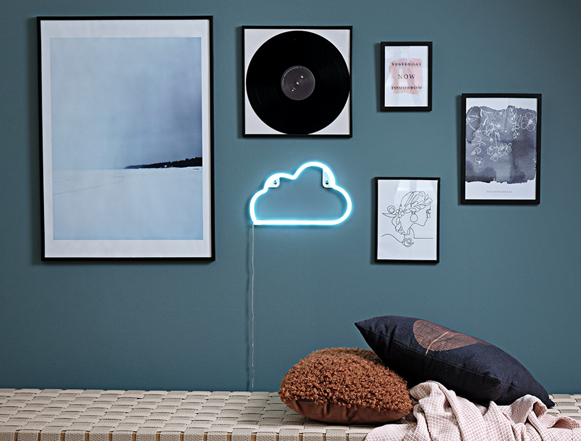 Wall with images in frames and NIELS lamp, shaped as a cloud Wall with images in frames and NIELS lamp, shaped as a cloud