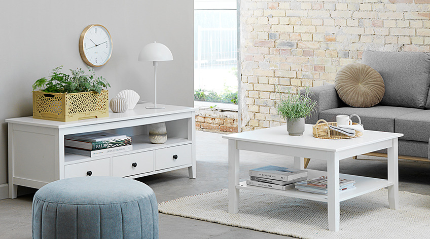 NORDBY tv stand, DARUP pouffe, ARENDAL sofa and NORDBY coffee table Light living room with white tv stand and coffee table, grey sofa and mint pouffe in the foreground