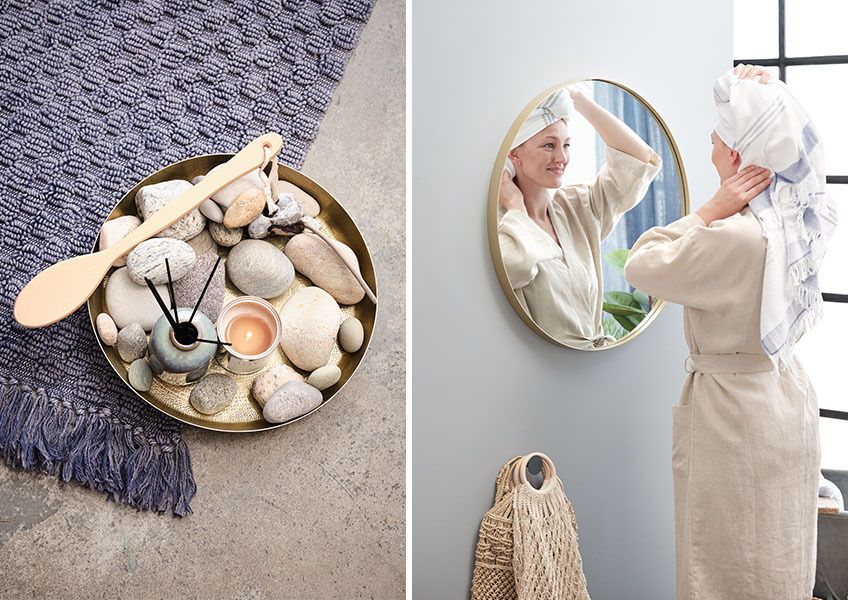 ALUNDA bathrobe and LIDEN scented oil Women in bathrobe in front of round mirror and tray with scented oil