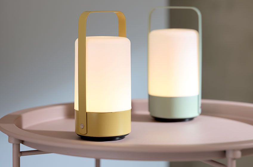 Two VILLY LED battery lamps on RANDERUP end table in rose Two LED battery lamps on an end table