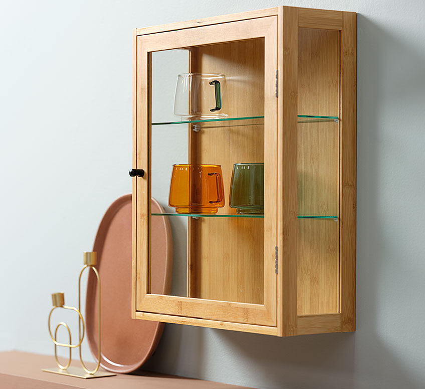 TREND cabinet with hand-blown glass cups ANDERS and ERVIN candlestick and ASKE tray Small cabinet with hand-blown glass cups and candlestick and tray in the background