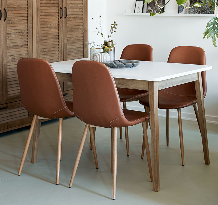 JONSTRUP dining chair in cognac coloured faux leather around GAMMELGAB dining table Dining table with 4 dining chairs in faux leather