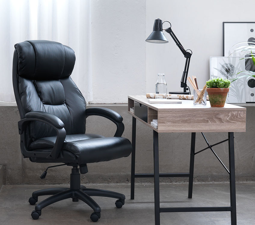 Black executive office chair at an office desk