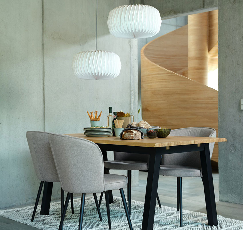 Dining table with four dining chairs in grey with black legs and two white pendants