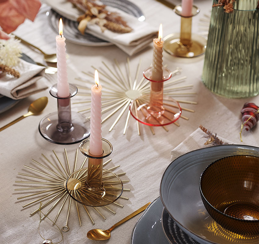 STELLAN wall decoration used as table decoration Gold decoration, candlesticks and candles on New Year’s table