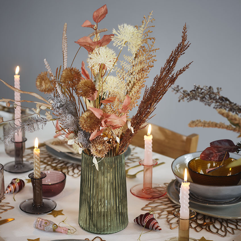 Green glass vase and candlesticks in glass with twisted candles