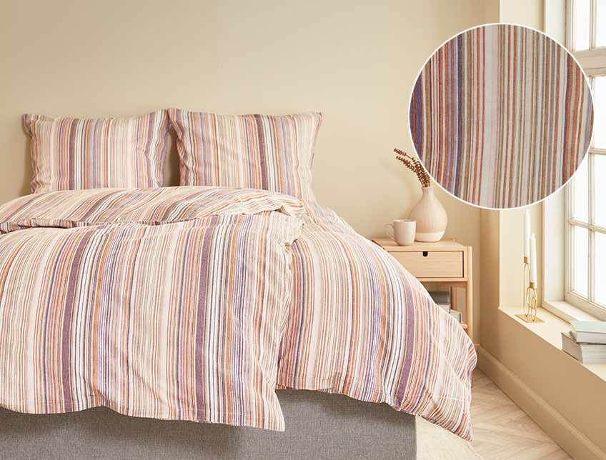 ABBIE bed linen in 100 % cotton, with stripes in different shades of orange, purple and green Bedroom with two duvets and two pillows, with striped duvet cover sets