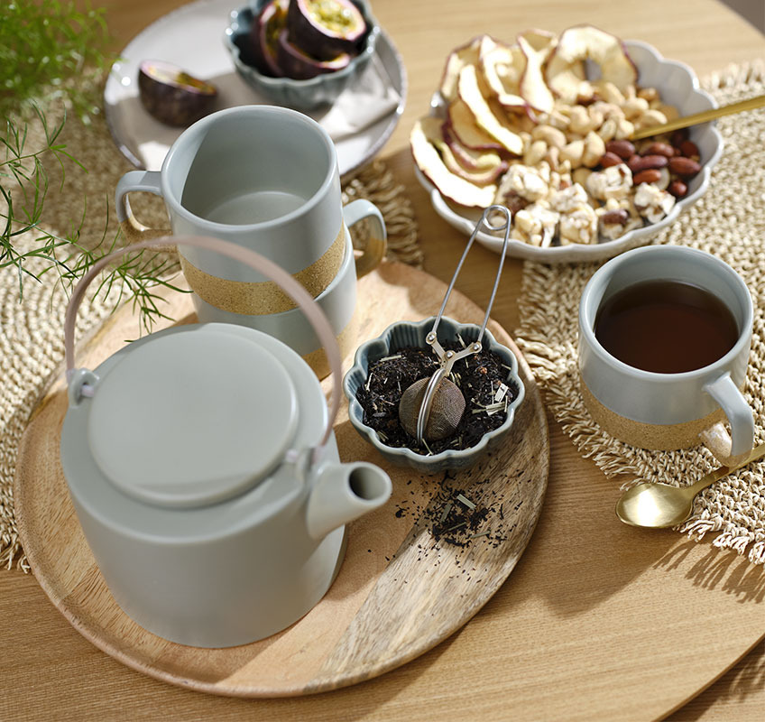 SIMON green bowl, GAUTE teapot, HALFDAN mugs and GERNER tray Wooden tray with green teapot and mugs and small bowls with snacks and tea